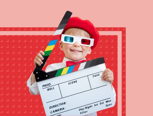 A little boy with 3D glasses and a clapperboard